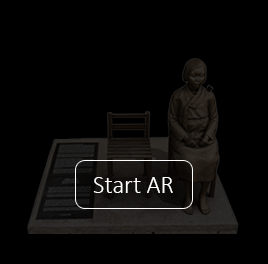 Virtual Statue of Peace — browser-based AR monument showing a seated bronze figure